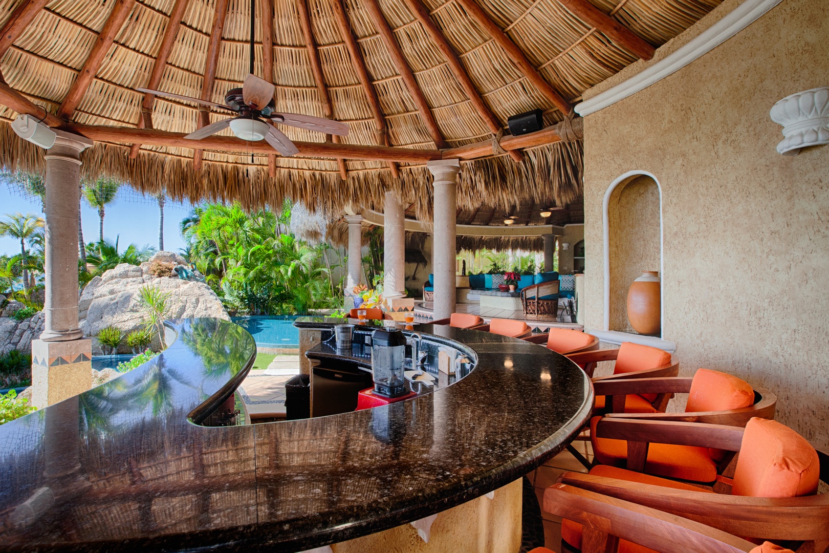 Relax at your private palapa bar with stunning pool views and tropical ambiance surrounding you.