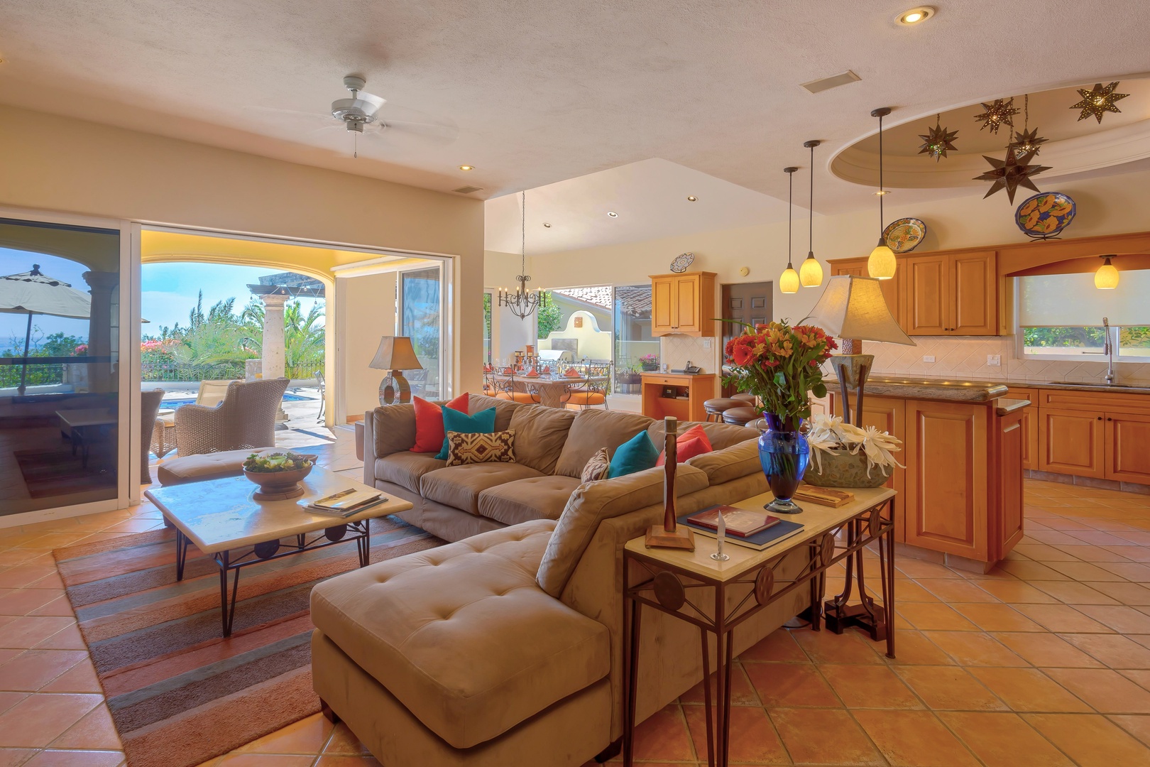 Relax in your spacious open-plan living area with designer touches and terracotta tiles flowing to the gourmet kitchen.