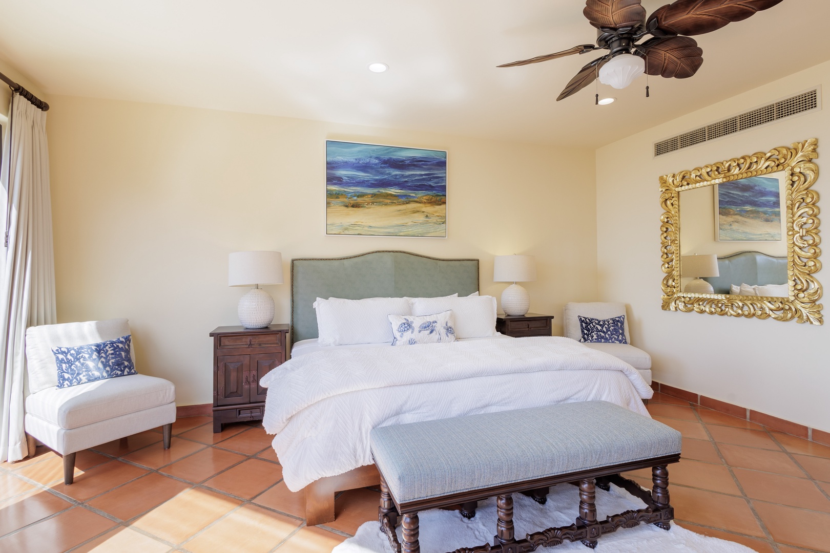 Sink into crisp linens and coastal-inspired décor in your serene bedroom retreat. Ceiling fan breezes and elegant accents create your perfect escape for restful nights.
