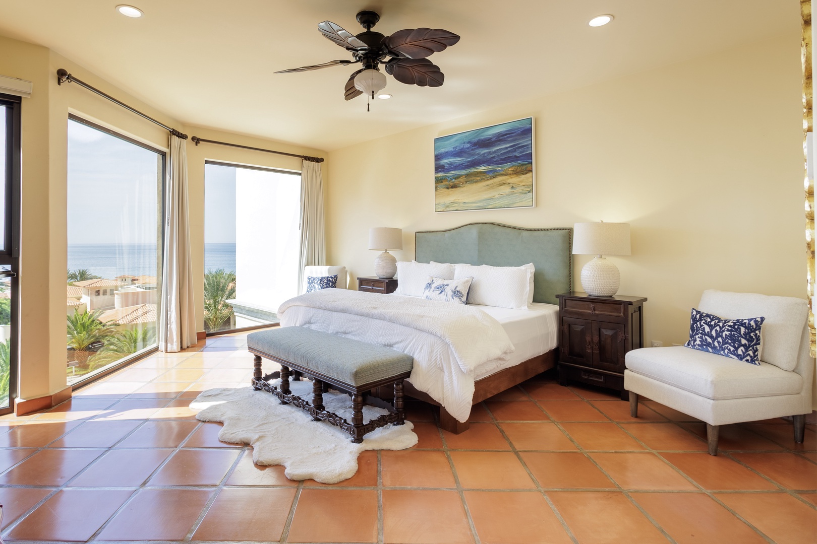 Wake up to stunning ocean views from your serene bedroom retreat. Drift off to the sound of waves, enjoy the gentle ceiling fan breeze, and step out to your private balcony for morning coffee by the sea.