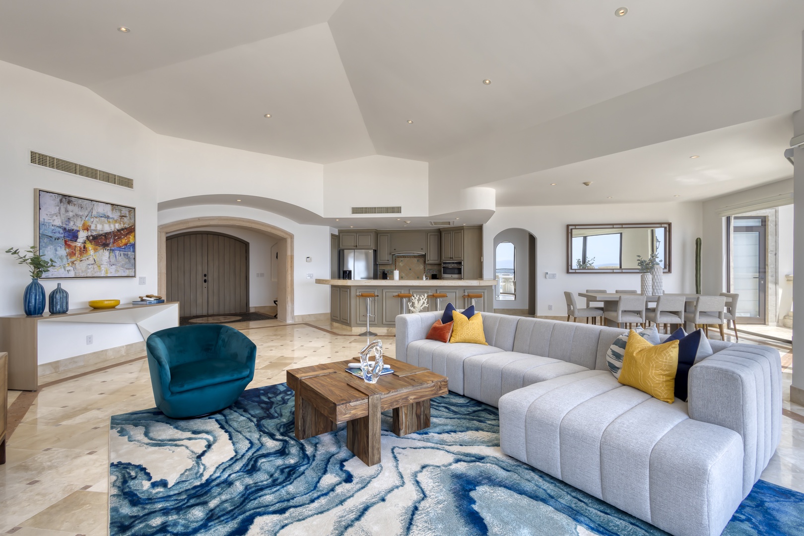 Sink into plush sofas and soak in the elegant, open layout—your perfect retreat where coastal sophistication meets comfort in every corner.