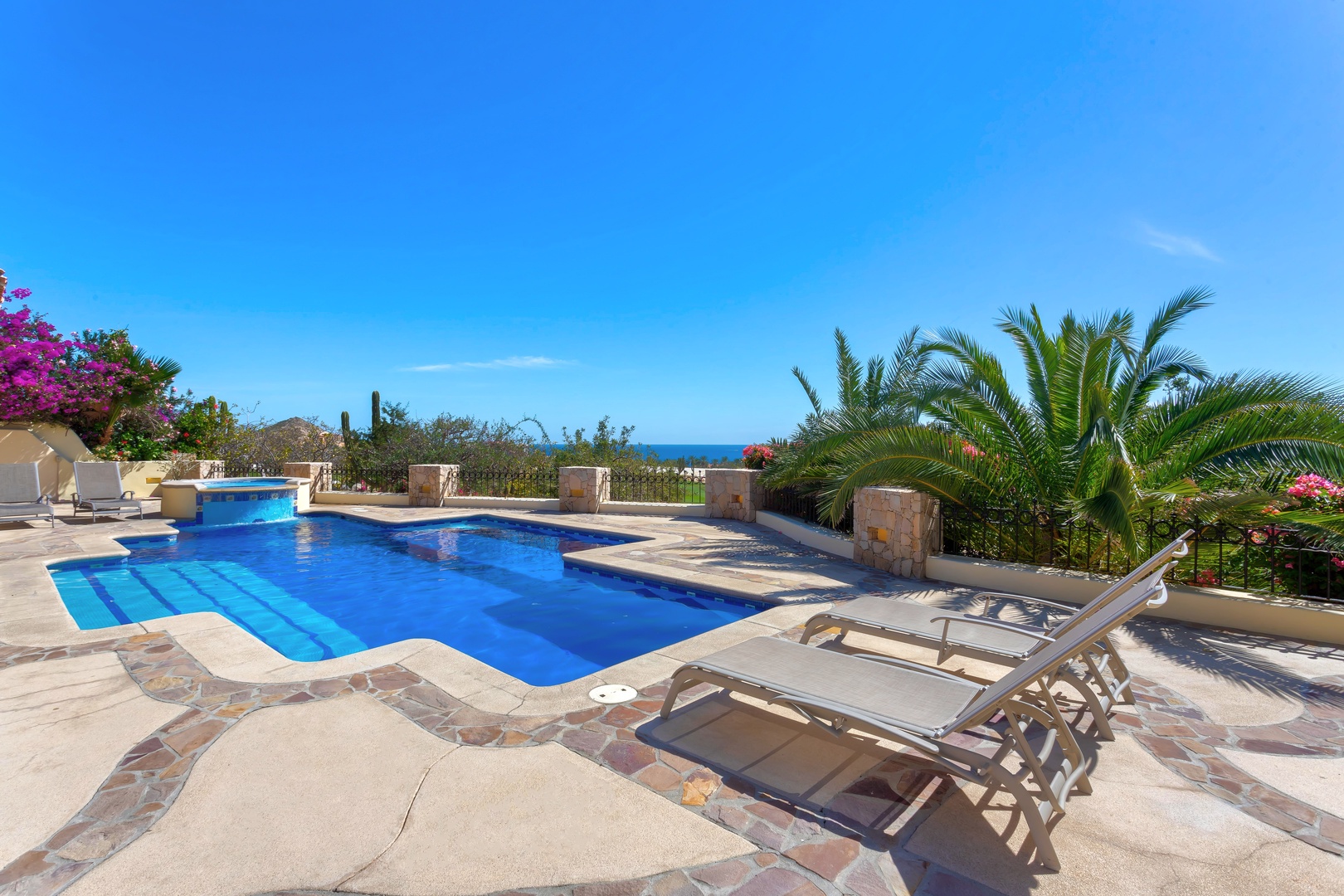 Dive into your private pool paradise, surrounded by tropical palms and stunning ocean views.