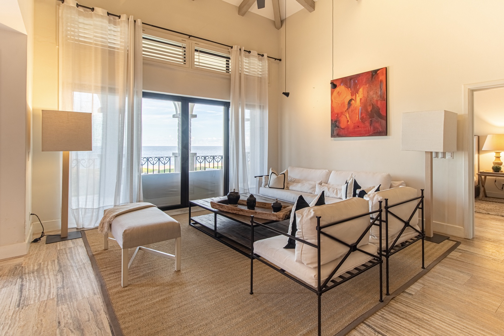 Relax in your light-filled living room, where vaulted ceilings, plush seating, and sweeping views create an elegant space designed for unwinding after a day of adventure.