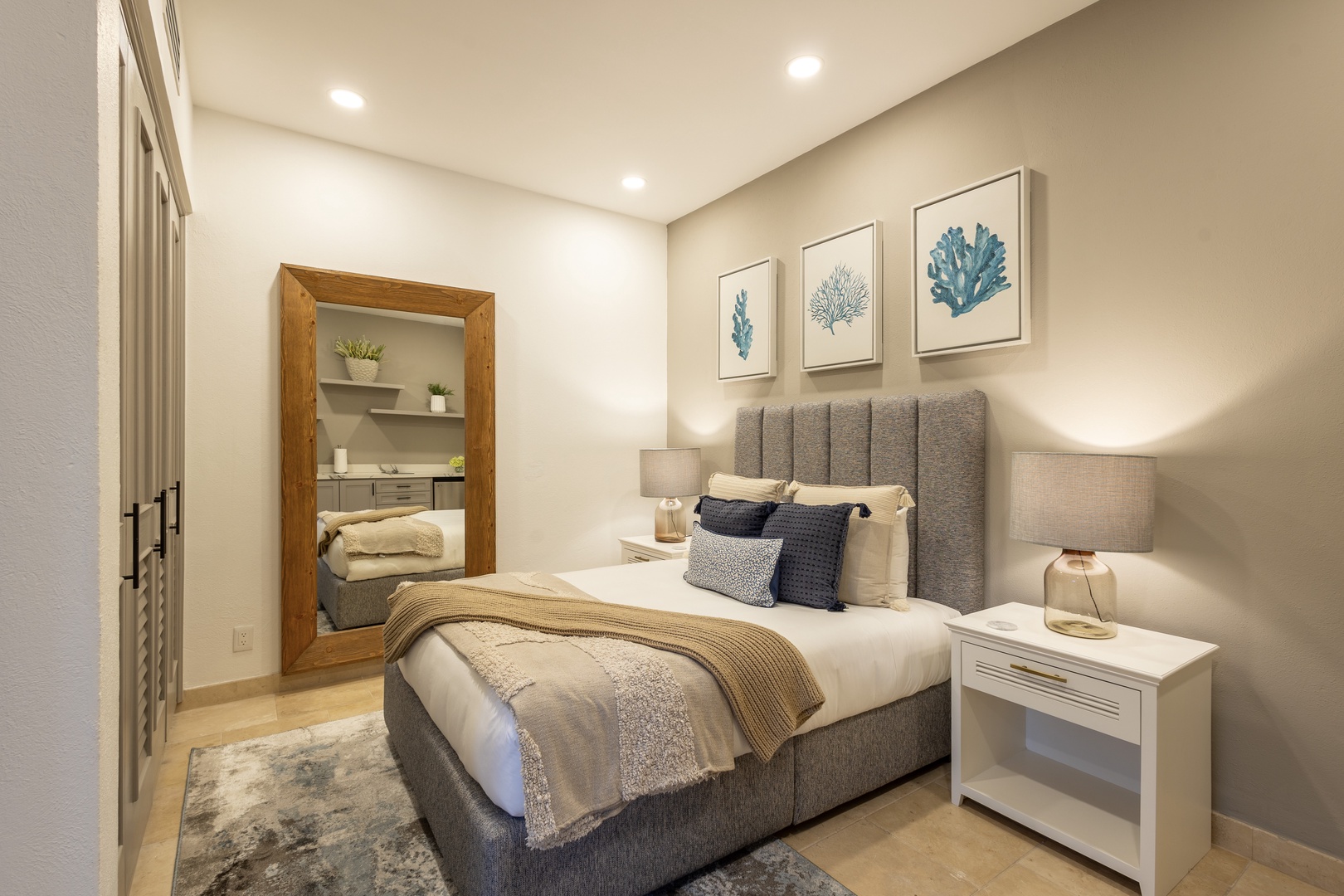 Drift into restful sleep in your serene bedroom, where coastal artwork and soft linens create your peaceful retreat after a day of adventure.