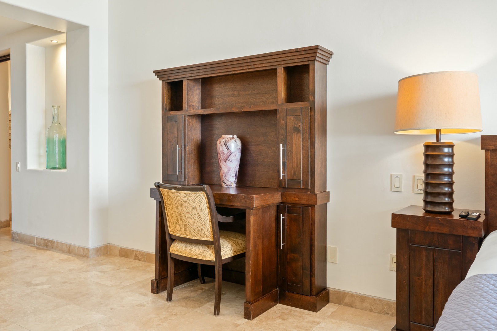 Your workspace awaits with rich wood furnishings and warm lighting for productive mornings or evening planning.