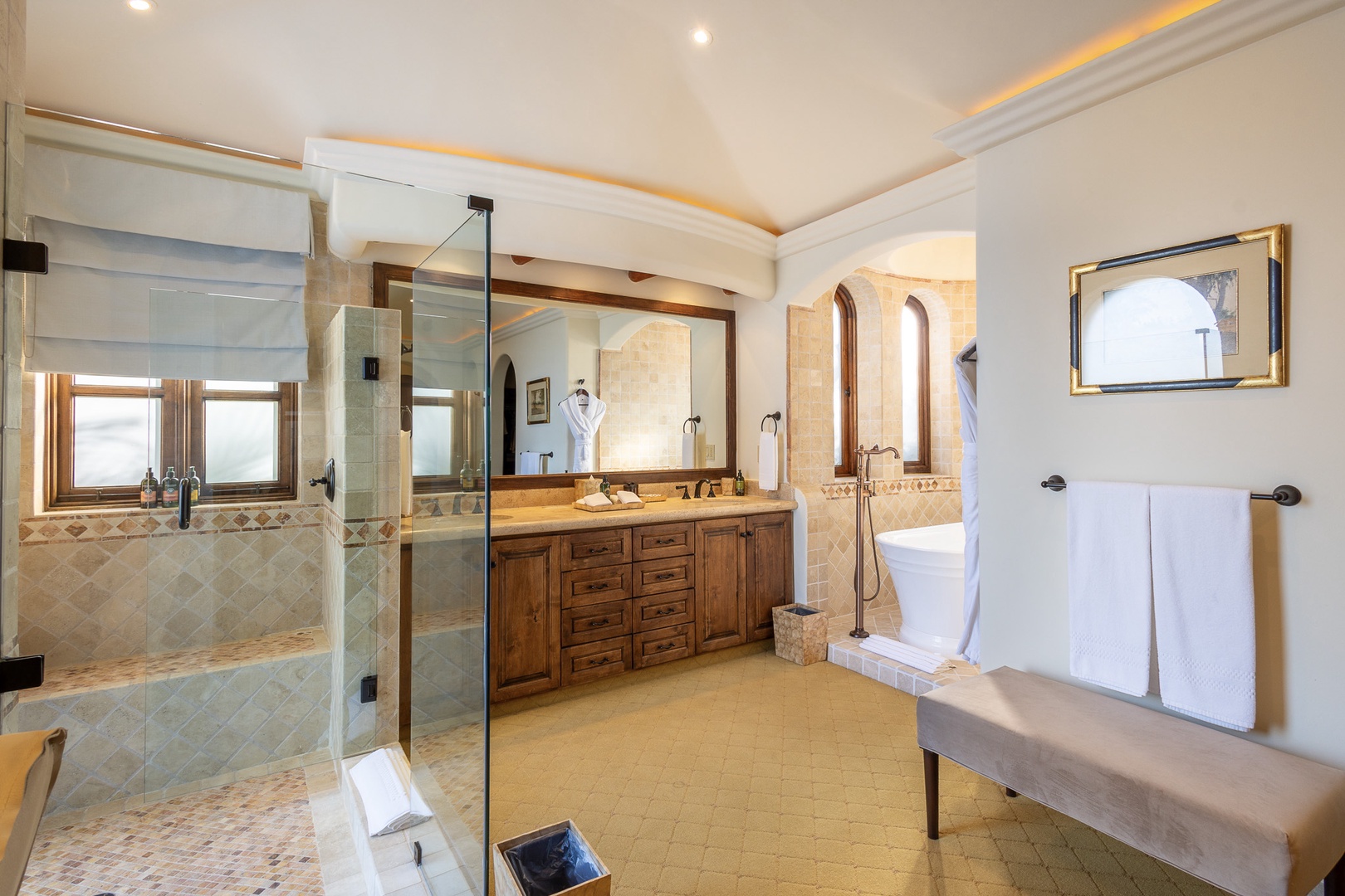 Indulge in spa-like luxury with your spacious ensuite featuring a rain shower, dual vanities, and plush linens ready for your arrival.