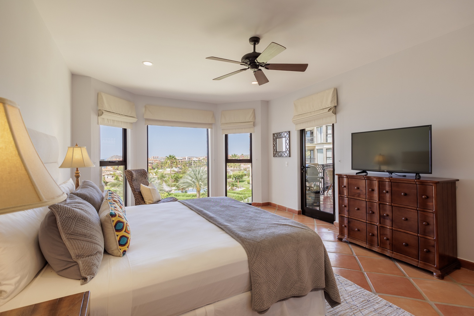 Step into your serene retreat where plush bedding awaits and sweeping views of lush gardens greet you each morning. Relax in comfort with modern amenities and open your private balcony doors to let the breeze flow through your peaceful sanctuary.