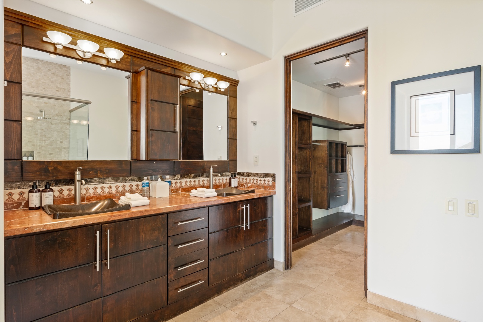 Step into your luxurious master bathroom featuring rich wood cabinetry, elegant lighting, and sophisticated finishes that create your perfect morning retreat.