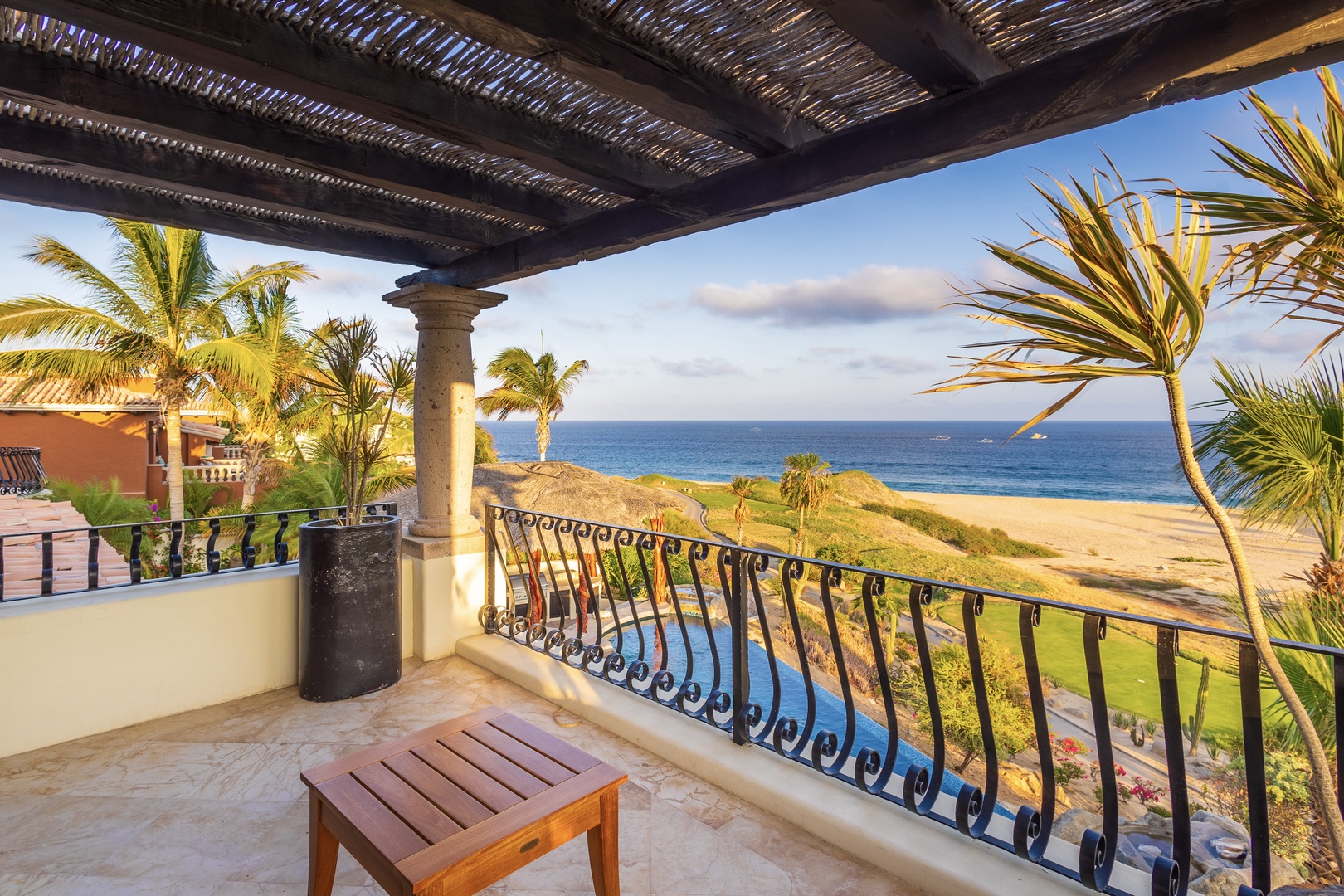 Unwind on your private balcony with sweeping ocean views, swaying palms, and golden sands just steps away—your perfect coastal escape awaits.