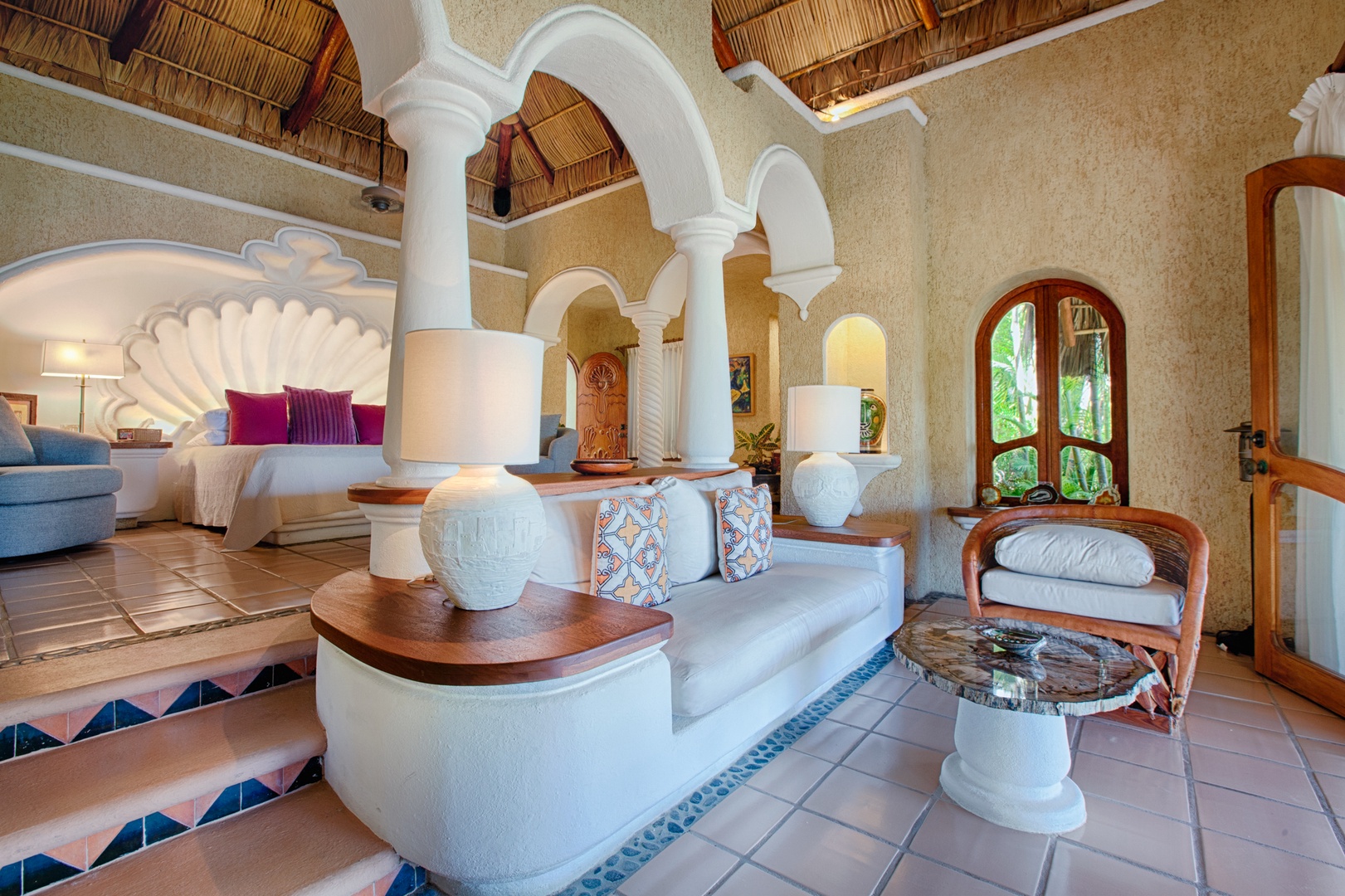 Sink into Mexican-inspired elegance with whitewashed arches, handcrafted tile floors, and plush seating that invites your most restful moments.