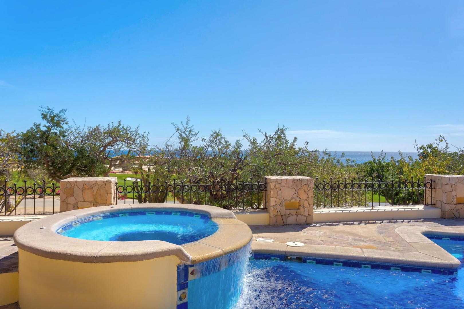 Relax in your private hot tub and pool while enjoying stunning ocean views from this beautifully landscaped terrace.