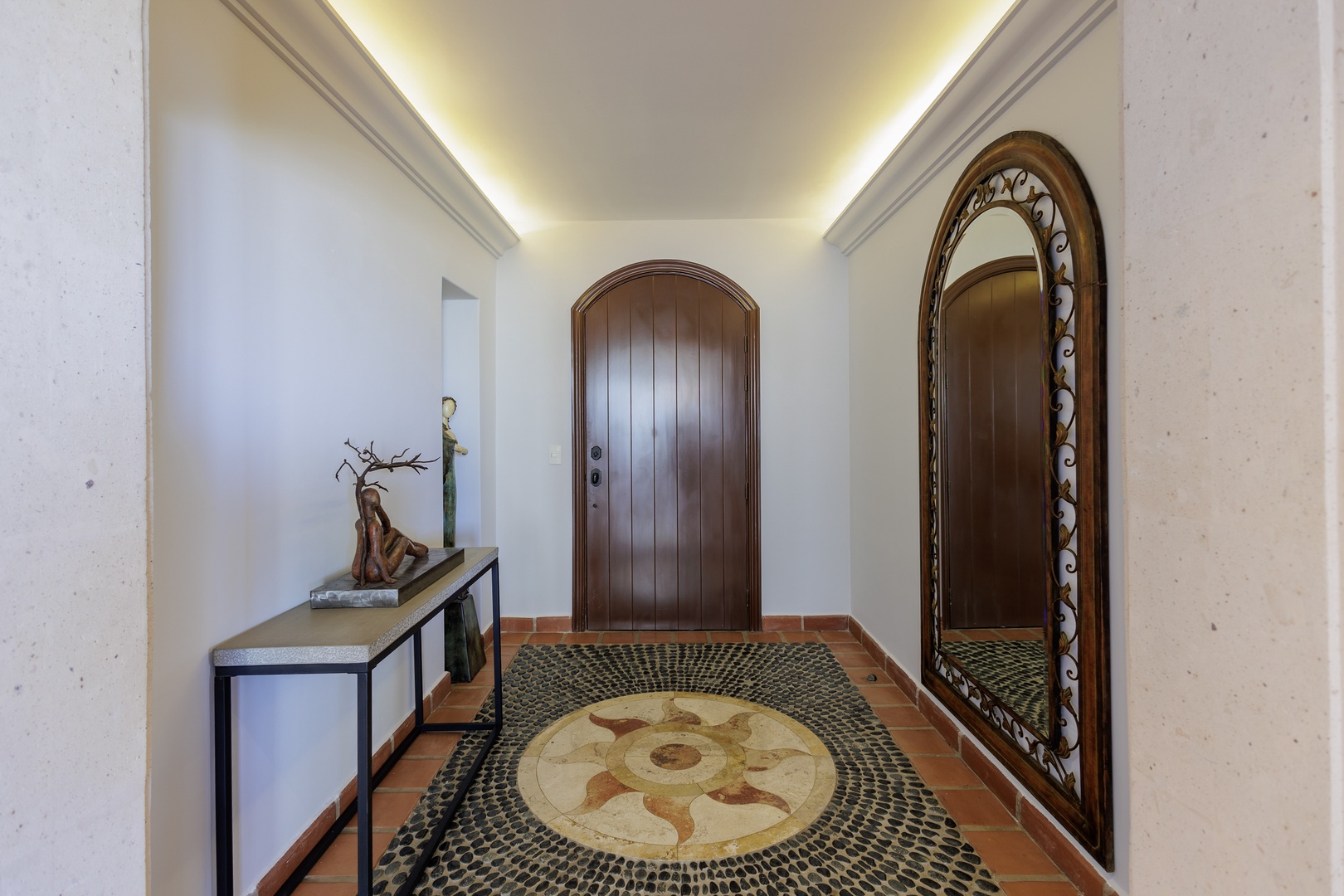 Step into your private entrance, where warm wood tones and elegant mosaic tile flooring welcome you home after each day of adventure.
