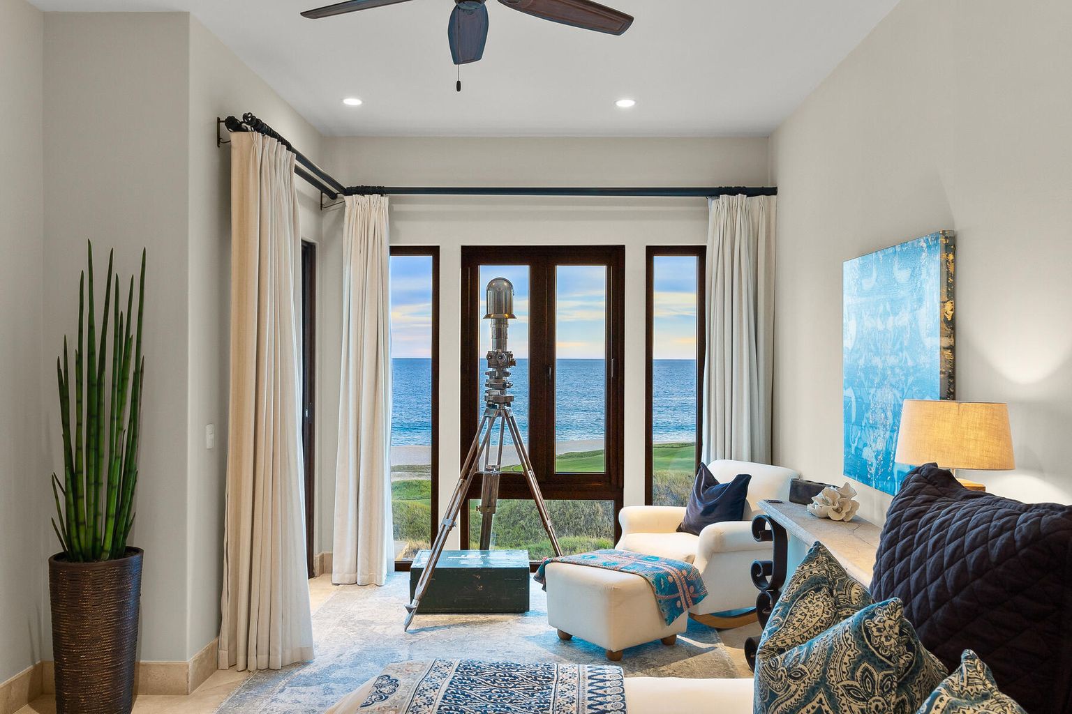 Settle into your elegant coastal retreat, where floor-to-ceiling windows frame stunning ocean views. Let the soothing blues and nautical accents transport you to relaxation the moment you arrive.