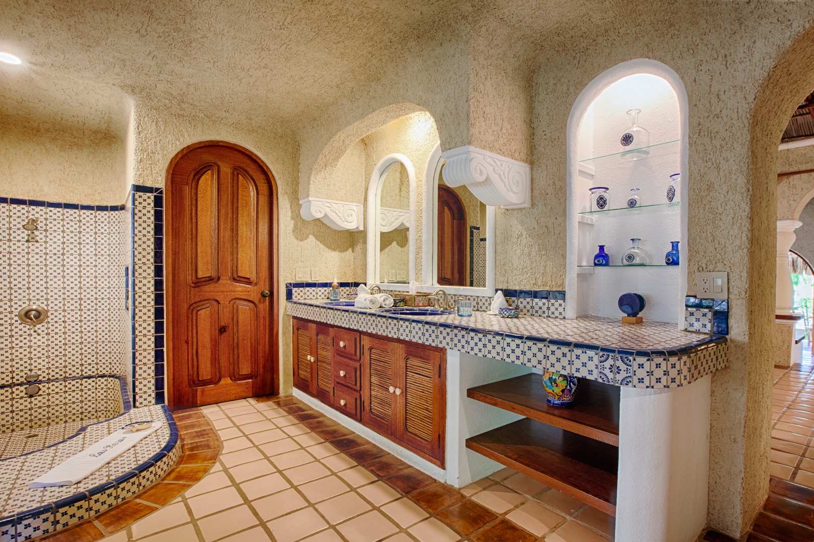 Immerse yourself in authentic Mexican charm with handcrafted tilework, arched doorways, and artistic details that create a truly magical bathing experience.