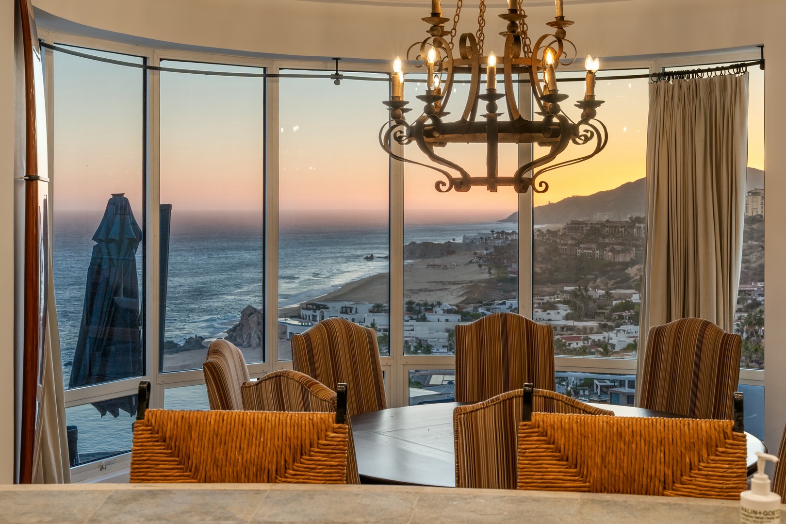 Dine while watching spectacular sunsets paint the ocean sky in this elegant space with panoramic coastal views.