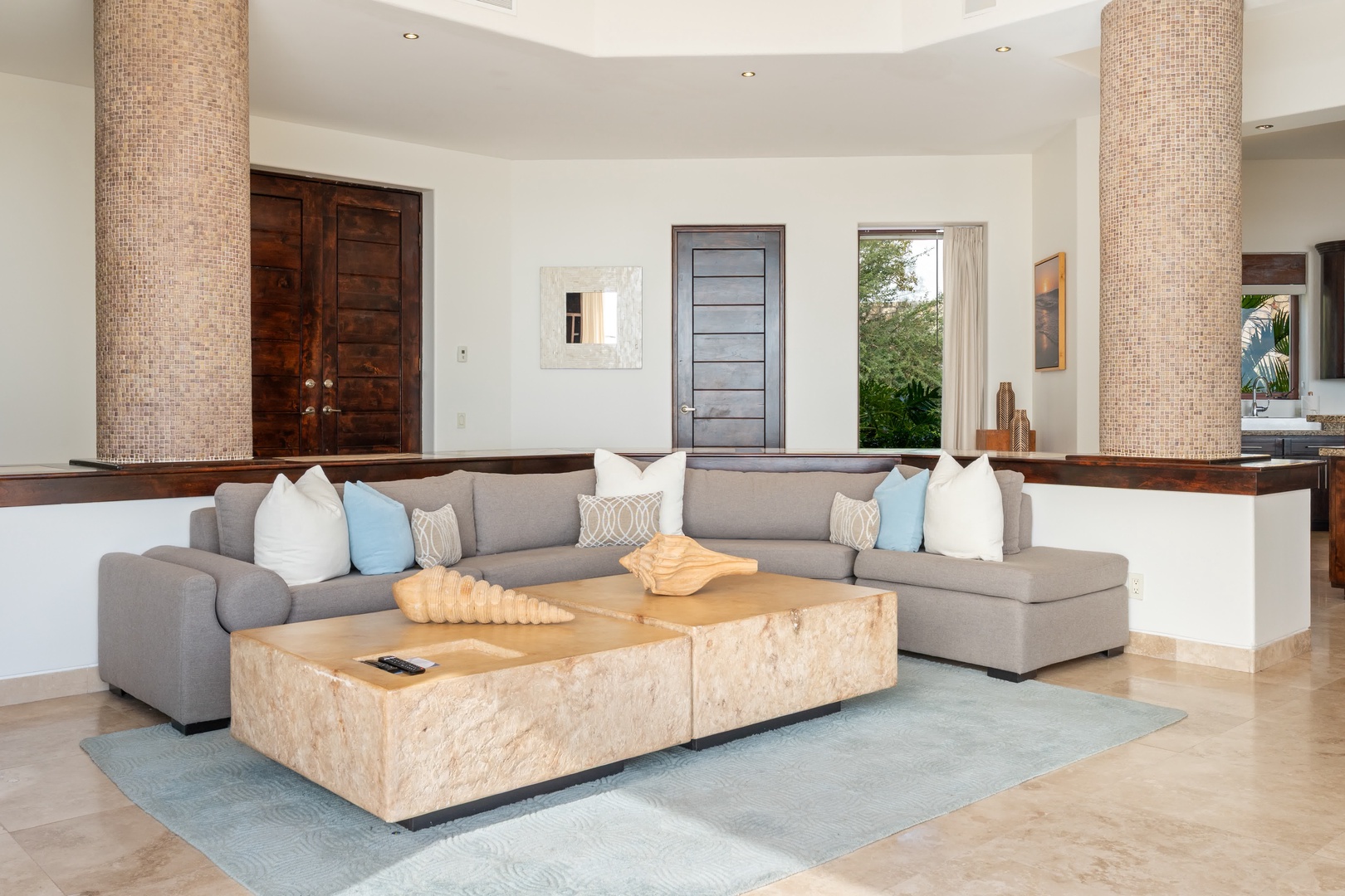 Sink into this gorgeous sectional sofa and feel instantly at home in your luxurious living space with stunning architectural details.