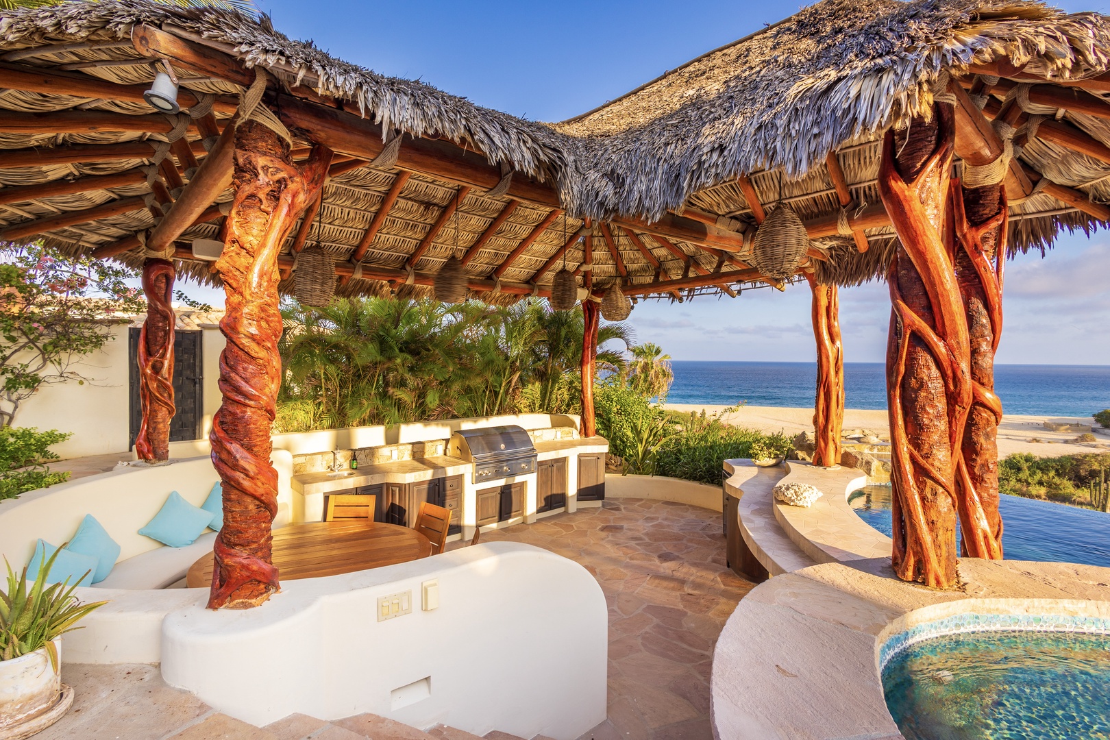 Unwind in your private palapa featuring a built-in grill, plush seating, and stunning beachfront views—your ultimate coastal escape.