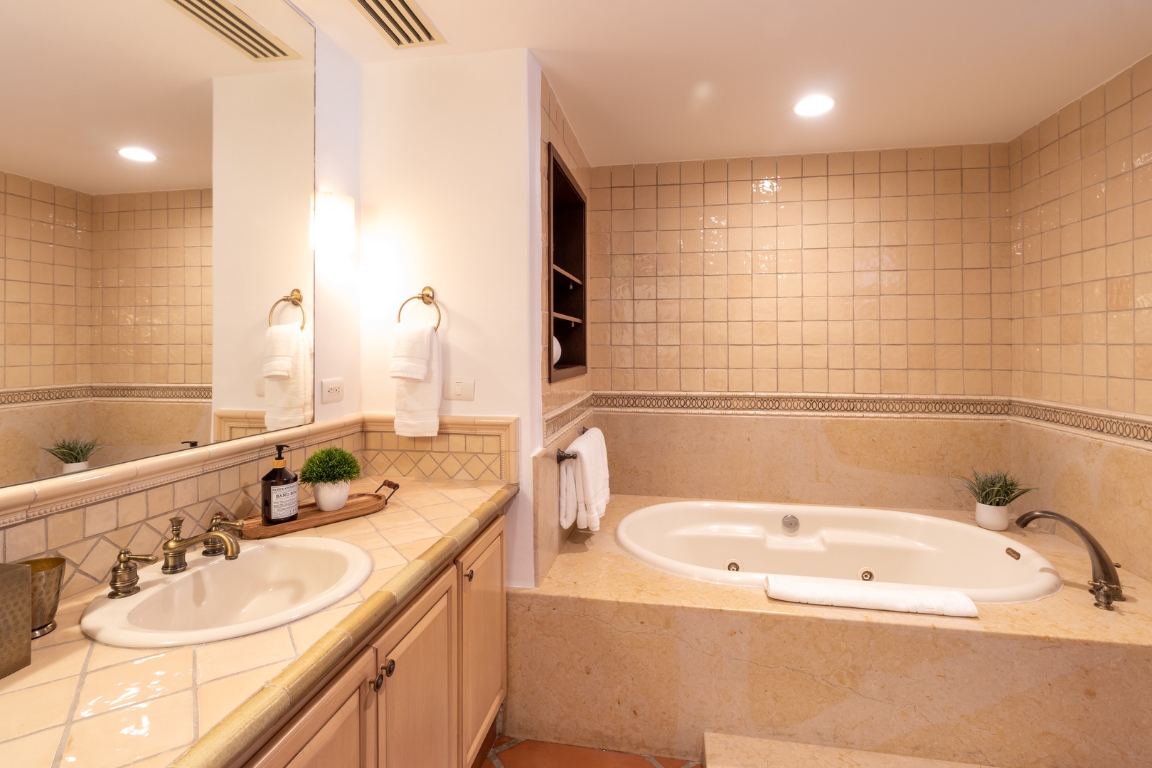 Unwind in your own spa-like retreat with warm tile surrounds, soft lighting, and a jetted soaking tub perfect for melting away the day's adventures.
