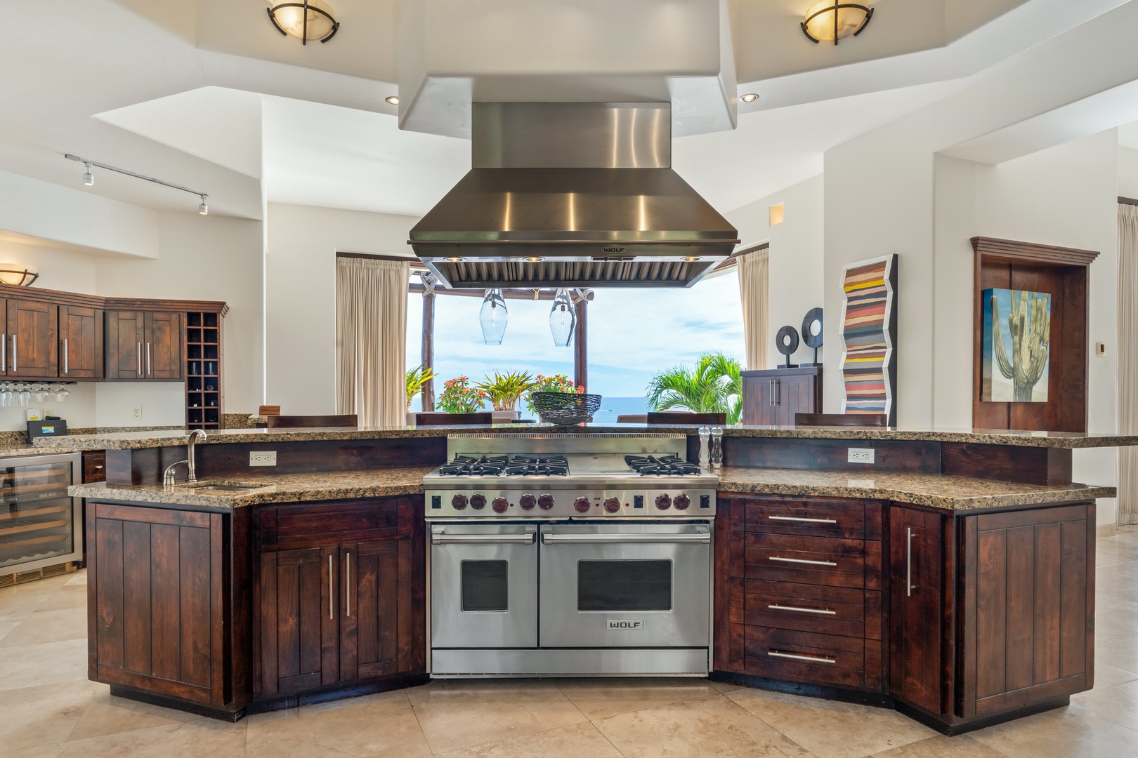 Your gourmet kitchen features professional-grade appliances and stunning ocean views, perfect for creating memorable meals during your stay.