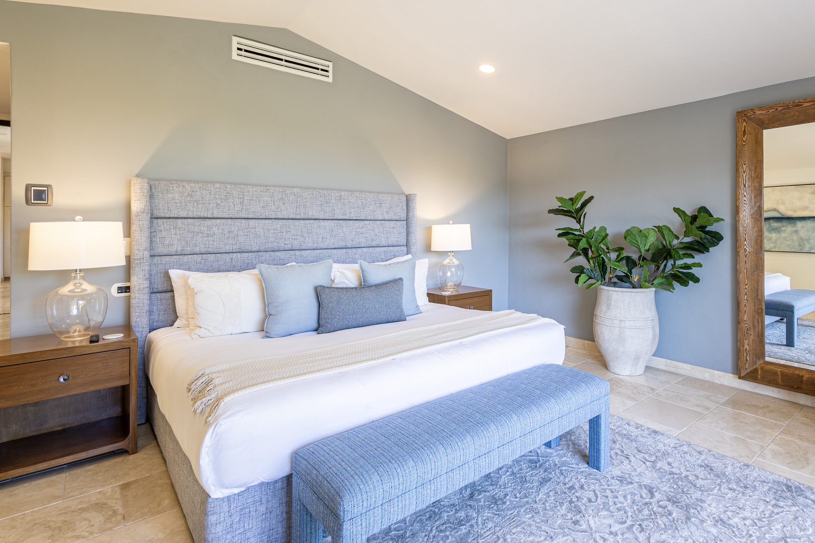 Step into your serene retreat with crisp linens, soft coastal blues, and soothing accents that invite you to unwind in complete comfort after a day exploring.