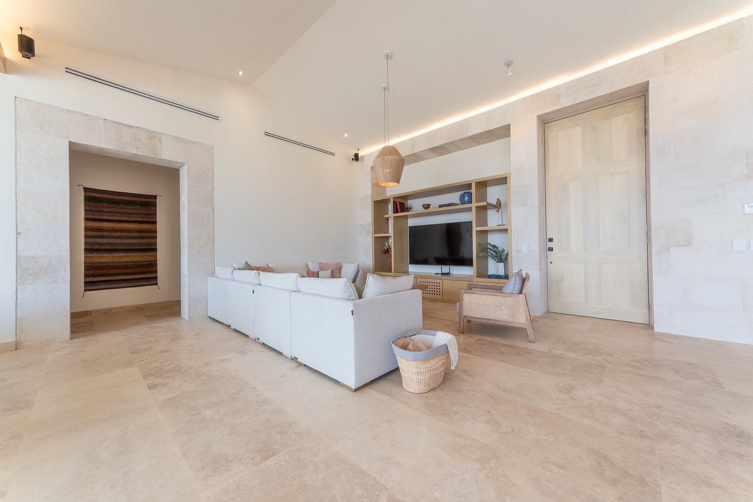 Your bright, open living space awaits—sink into plush seating, stream your favorite shows, and unwind with elegant modern comforts under softly glowing ambient lighting.