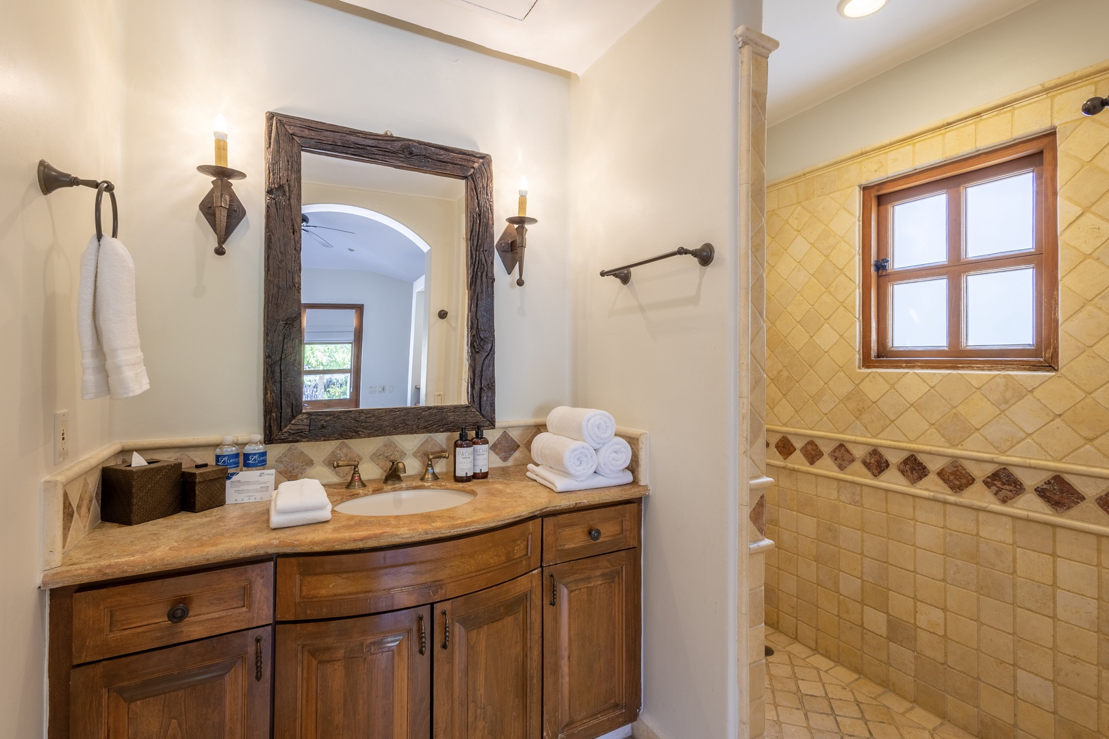 Indulge in your private spa-like bathroom with rustic charm and modern comfort for the perfect retreat.