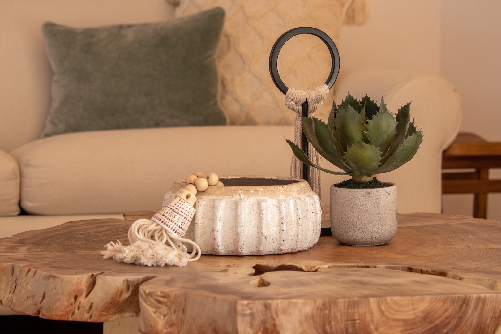 Settle into your cozy living space, where natural textures and thoughtful touches create a warm, inviting atmosphere for your perfect getaway.