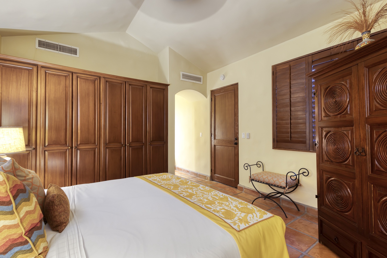 Relax in your elegant bedroom with handcrafted wooden wardrobes, crisp linens, and climate control for perfect comfort.