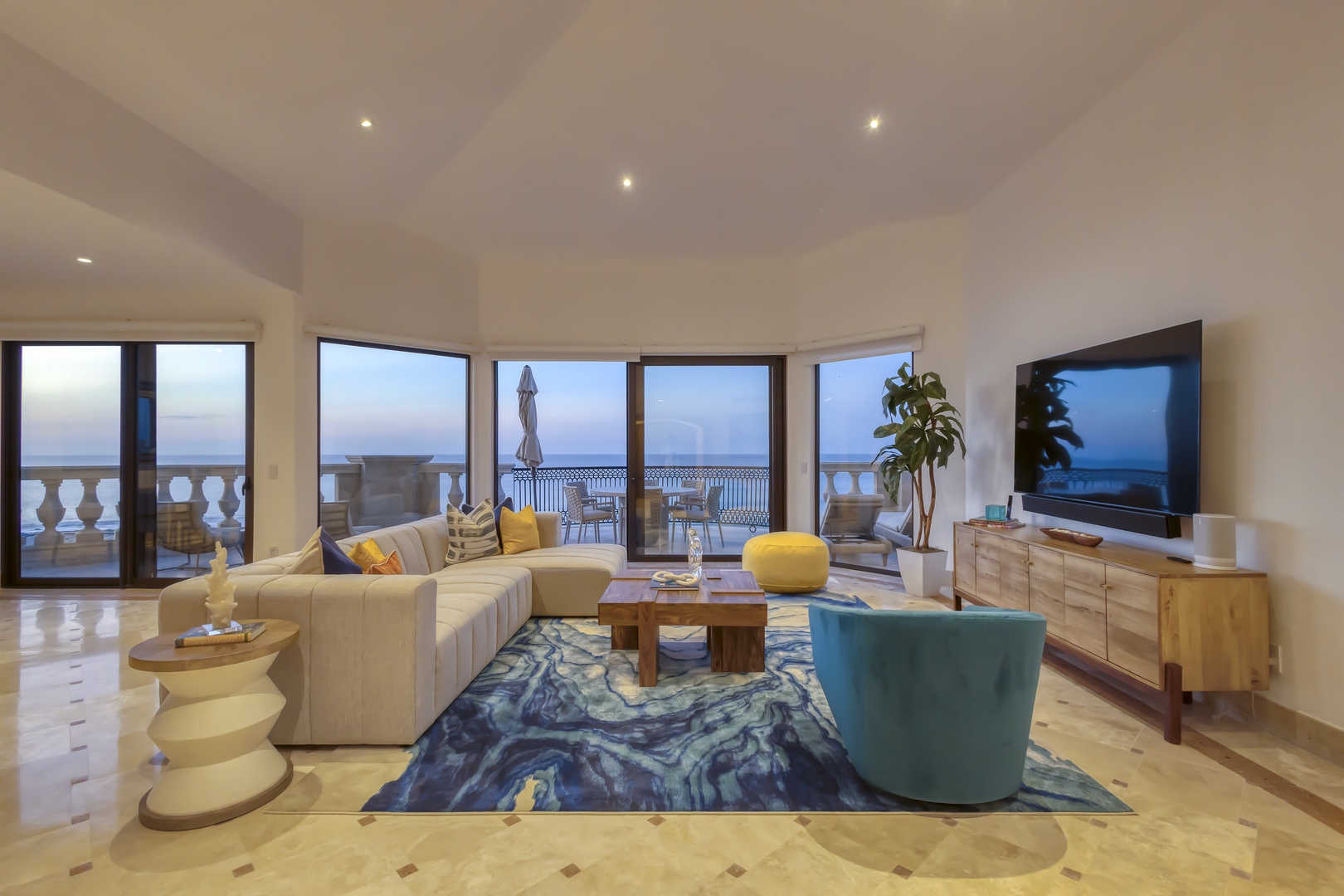 Sink into plush seating surrounded by floor-to-ceiling windows that frame breathtaking ocean views. Your private balcony and spacious living area create the perfect coastal retreat for relaxation and entertainment.