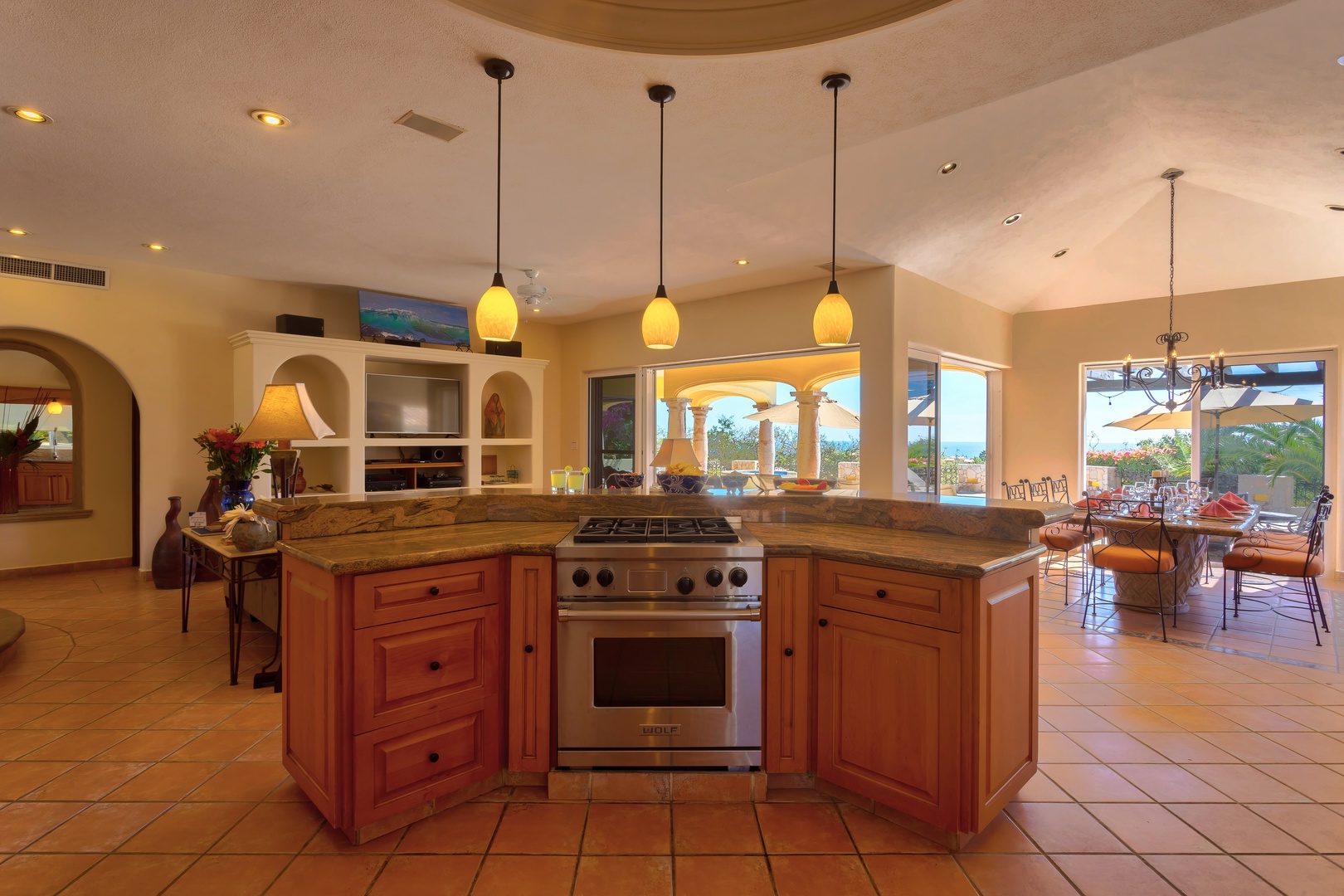Your gourmet kitchen awaits with granite counters, professional-grade appliances, and warm pendant lighting creating the perfect space for memorable meals.