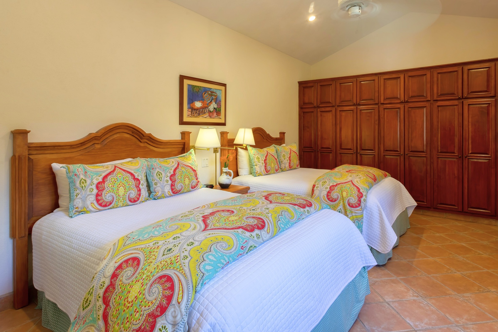 Rest peacefully in your twin bedroom with vibrant paisley linens, warm wood furnishings, and generous closet space for all your vacation essentials.