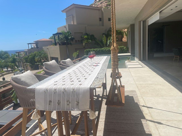 This spacious balcony offers scenic views and plenty of room to relax or dine outdoors. Imagine sipping your morning coffee here, with palm trees swaying and the ocean glimmering in the distance—a perfect spot to unwind in style.