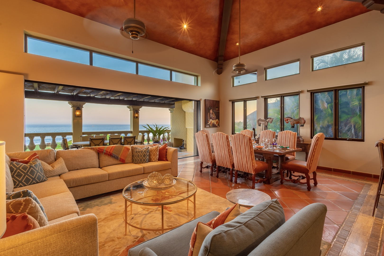 Sink into plush seating and soak up stunning sea views from your bright, open living and dining space with vaulted ceilings and coastal breezes.