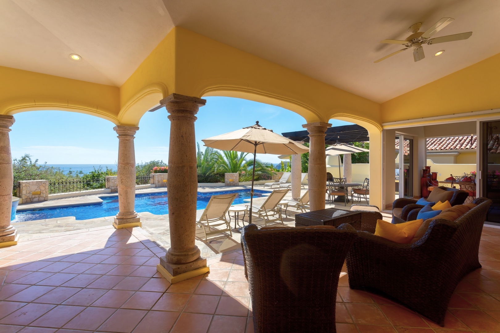 Your elegant living space opens to stunning ocean views and a sparkling pool, where relaxation meets paradise.