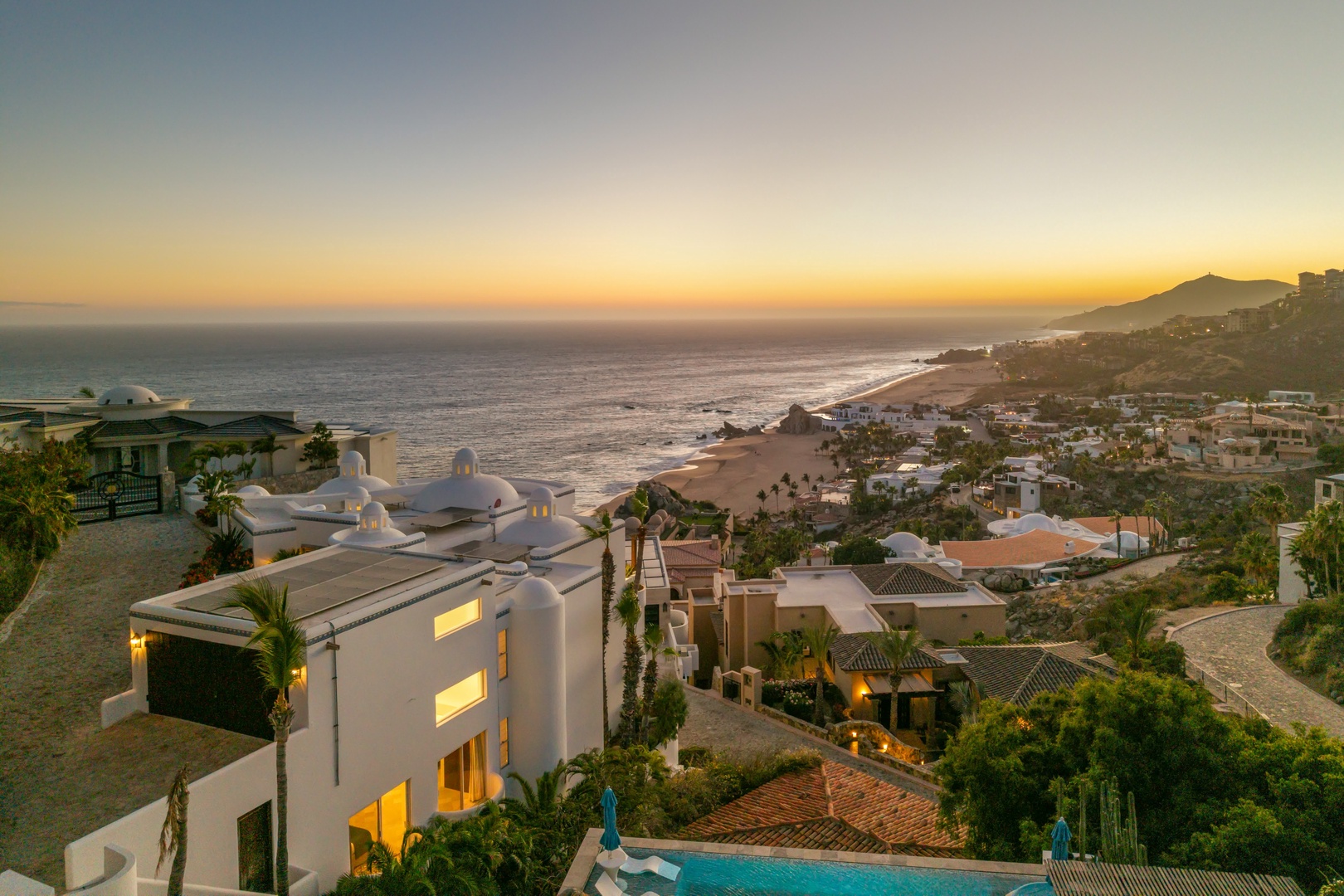Stunning coastal resort overlooking pristine beaches and endless ocean views at sunset.
