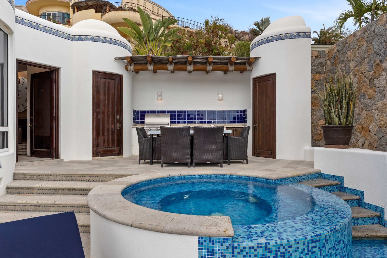 Your private oasis awaits with a sparkling pool and covered dining area where you can savor meals al fresco.
