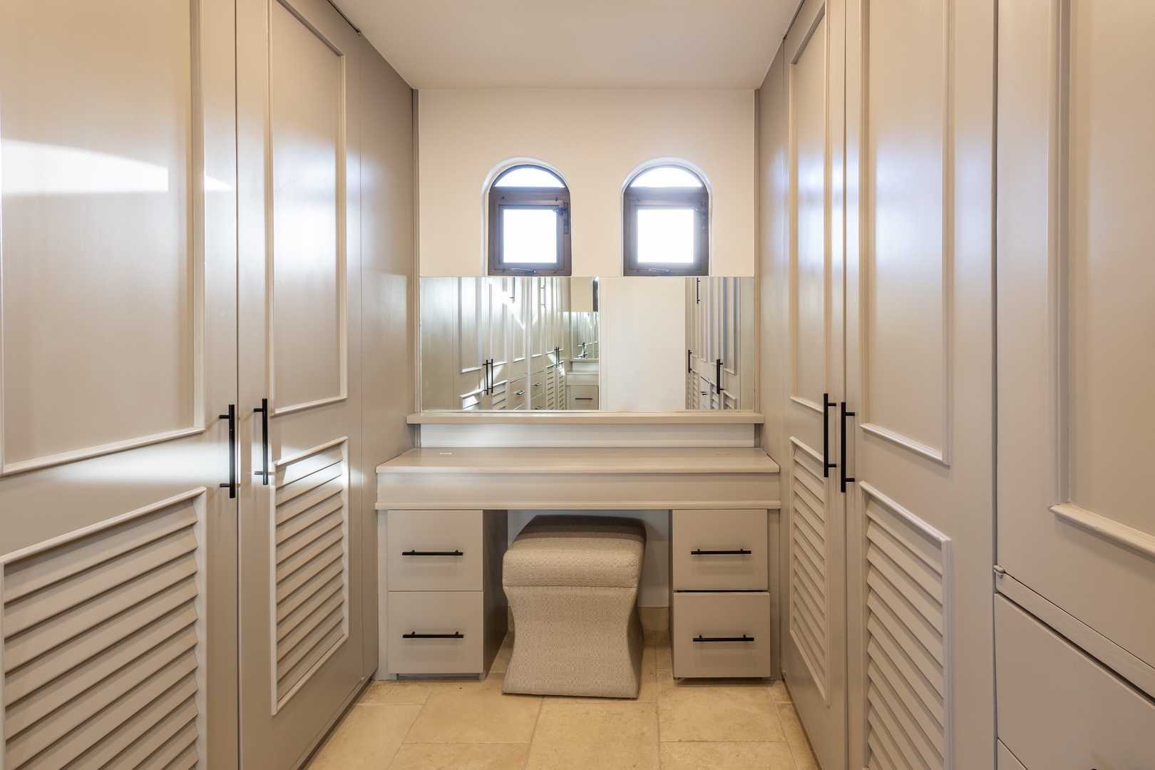 Your private dressing room features a spacious vanity area with ample storage, perfect for getting ready in style and comfort.