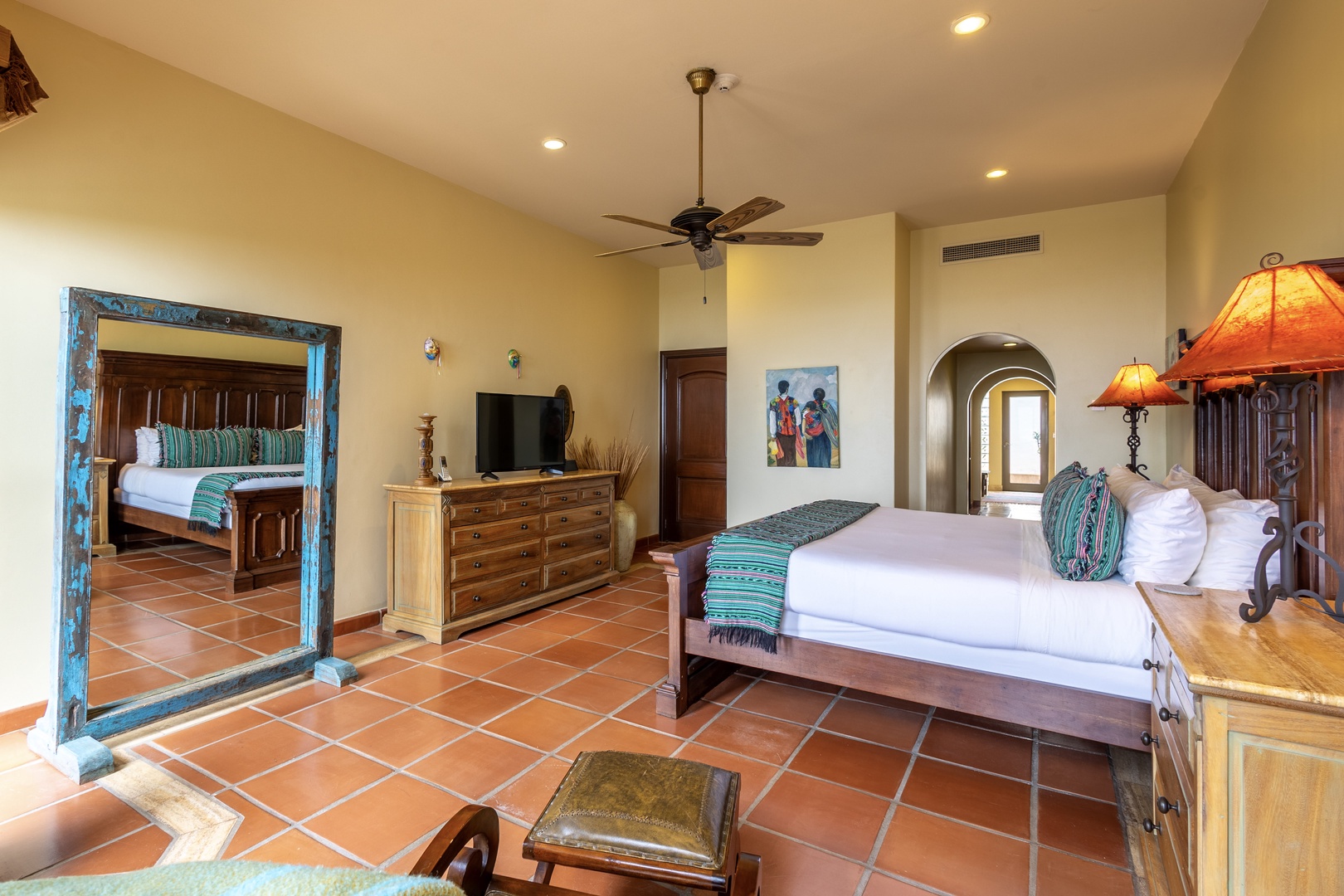 Step into your spacious retreat with handcrafted furnishings, warm terracotta tiles, and elegant archways. Relax in comfort with ceiling fans, AC, and charming décor that blends rustic charm with modern ease.