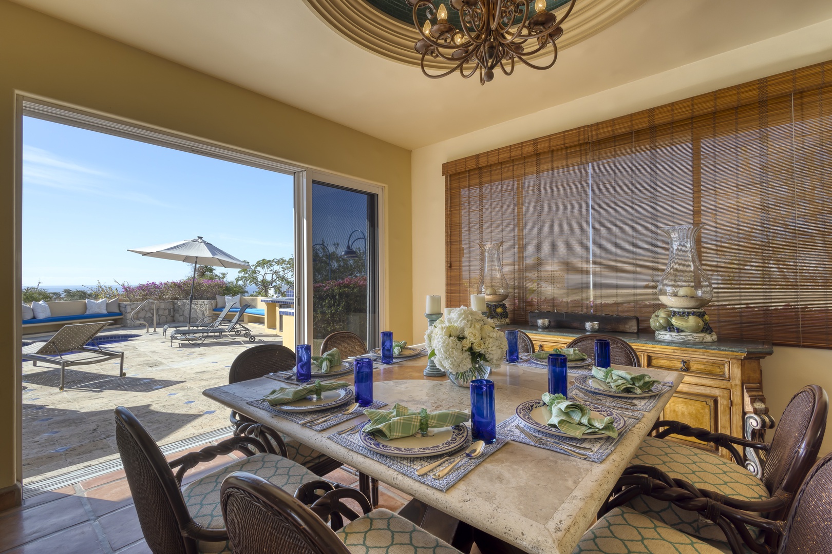 Dine with stunning pool views through floor-to-ceiling windows, where elegant table settings and warm decor create perfect moments for your memorable meals.