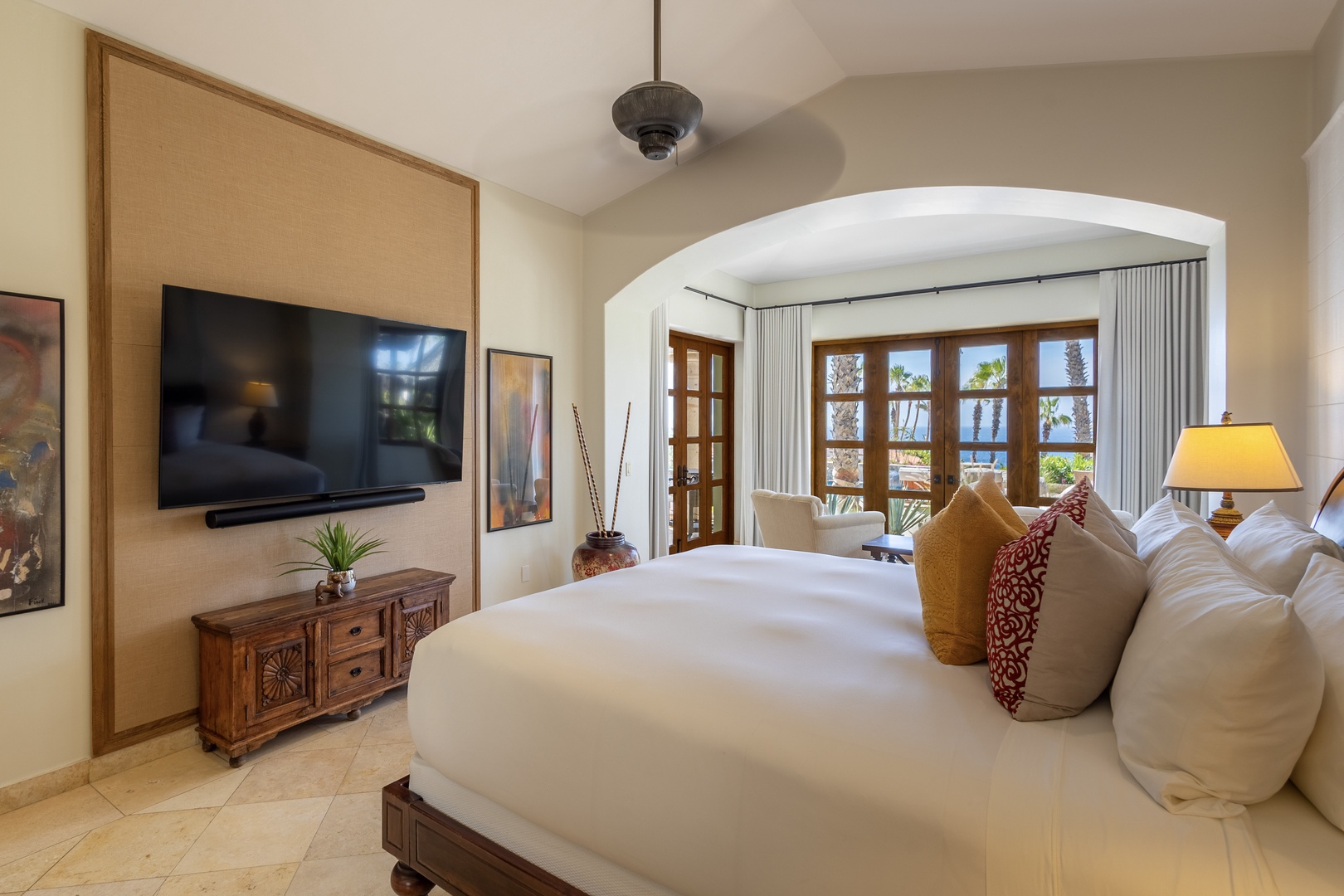 Relax in your elegantly appointed bedroom where crisp linens meet warm wood furnishings and your private balcony opens to stunning tropical views.