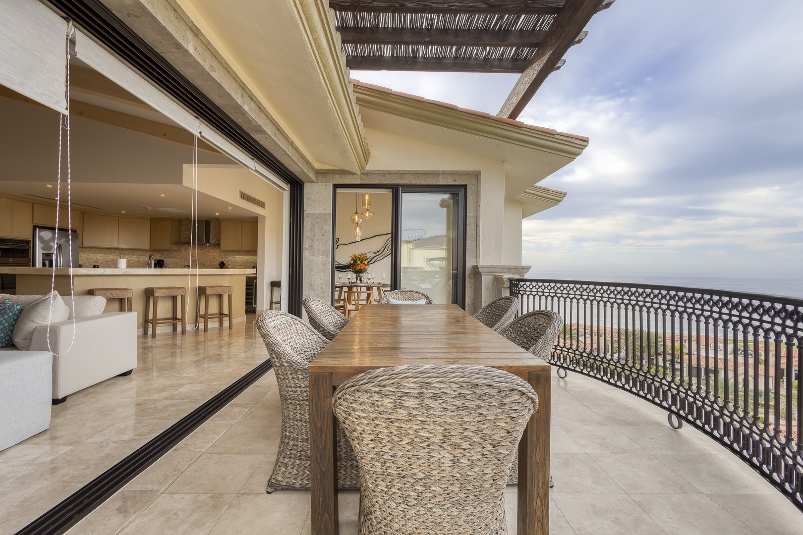 Savor your morning coffee or sunset cocktails at this inviting outdoor dining space, where panoramic views stretch to the horizon and seamless indoor-outdoor living lets you dine alfresco in style.