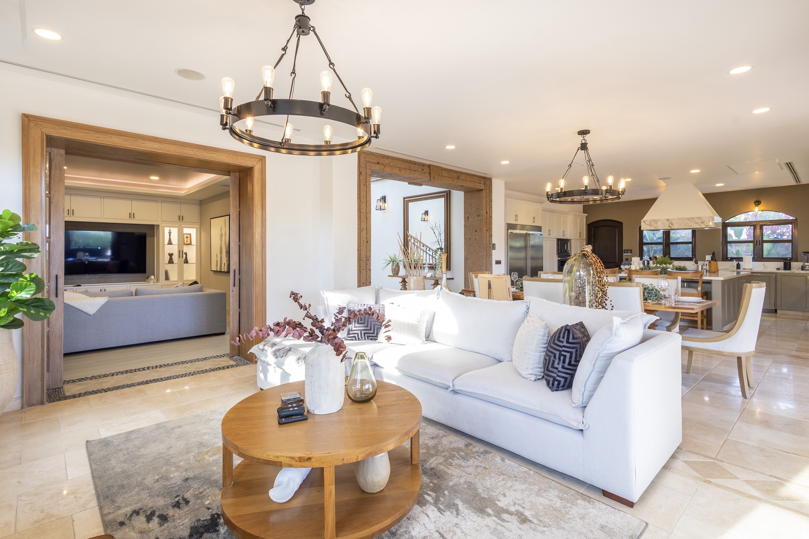 Sink into the plush sofa, gather around the handcrafted table, and enjoy the open flow connecting your living space to the fully equipped kitchen—perfect for quality time together.