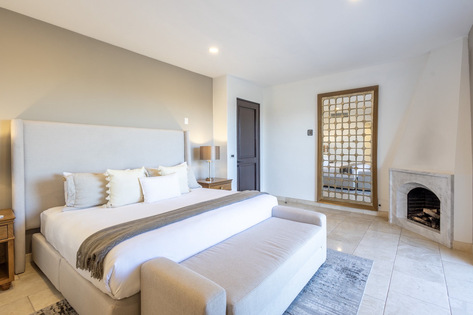 Slip into crisp linens and plush pillows after a long day, with soft lighting and a cozy fireplace creating your perfect retreat.