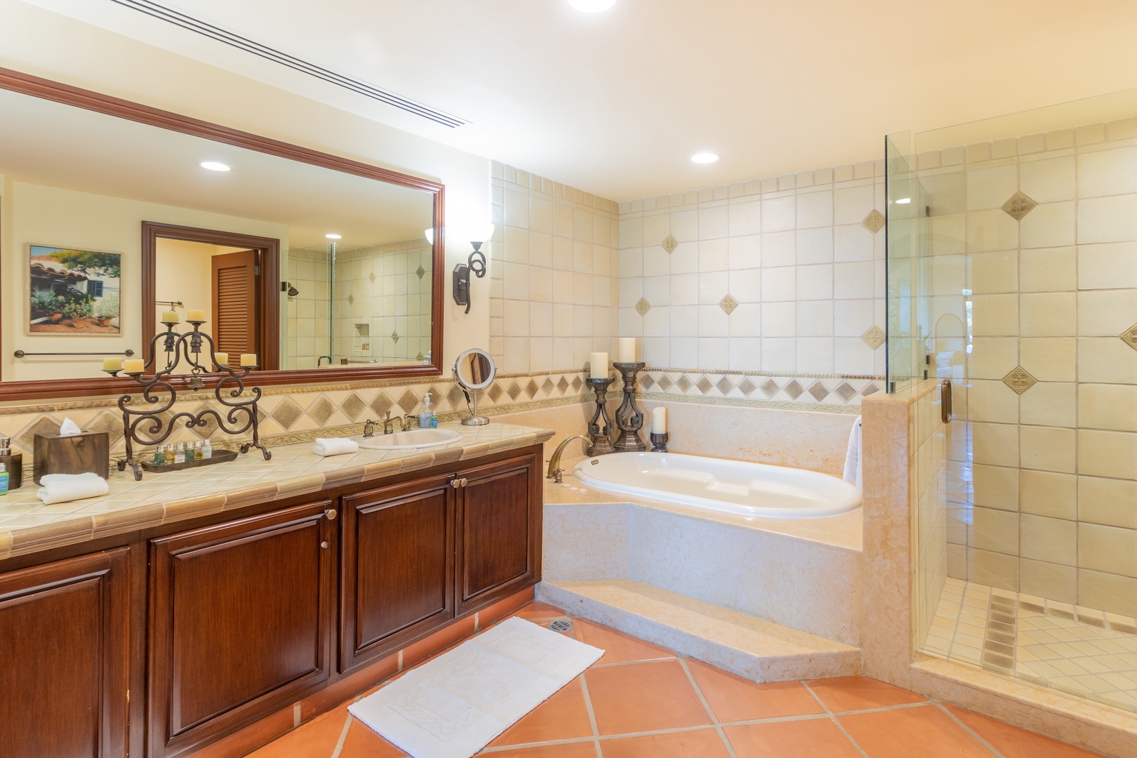 Unwind in your luxurious bathroom featuring a soaking tub, walk-in shower, and elegant tile work. Plush towels and warm lighting create a spa-like atmosphere for ultimate relaxation.