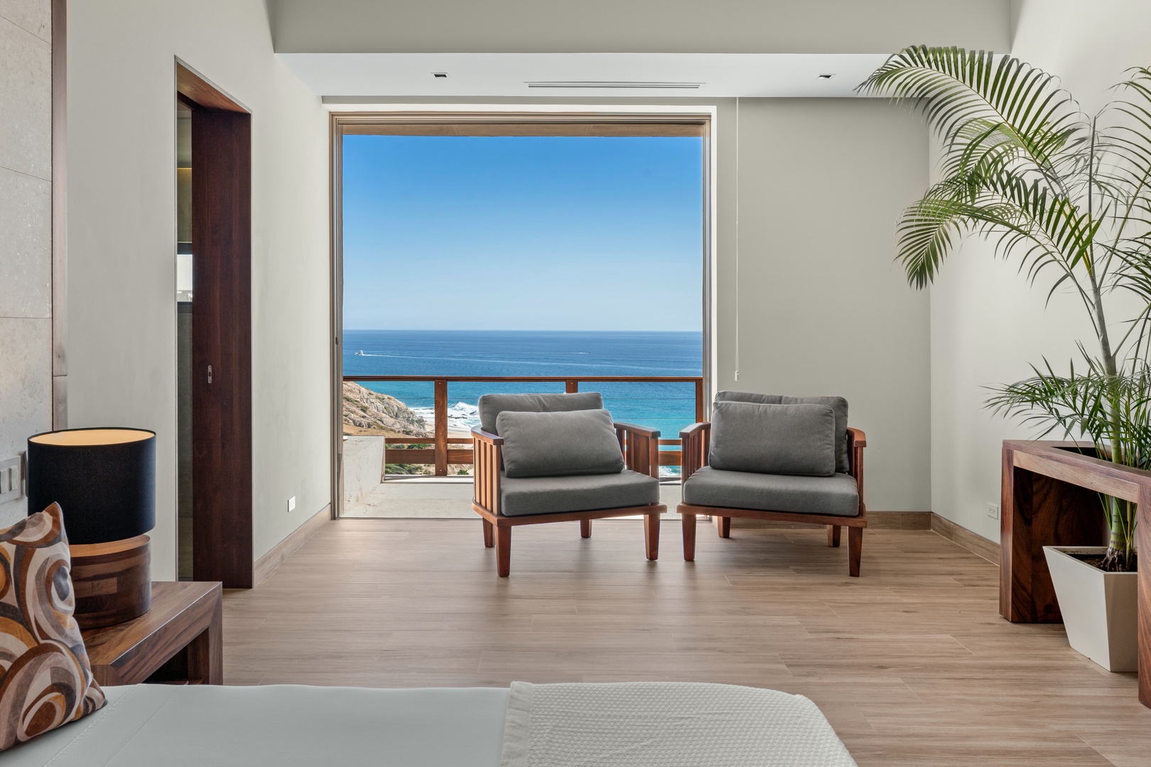 Unwind in your private retreat with sweeping ocean vistas through floor-to-ceiling windows. Sink into plush seating, feel the coastal breeze, and let the rhythm of the waves melt your stress away.
