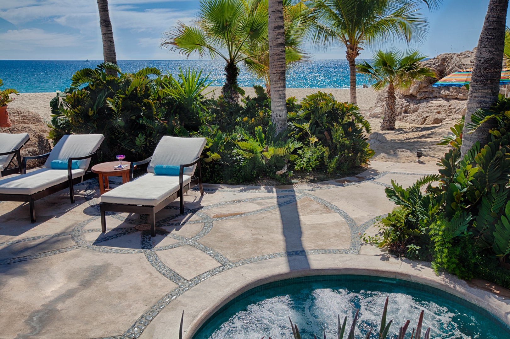 Relax in your private hot tub steps from pristine beach, surrounded by swaying palms and tropical paradise.