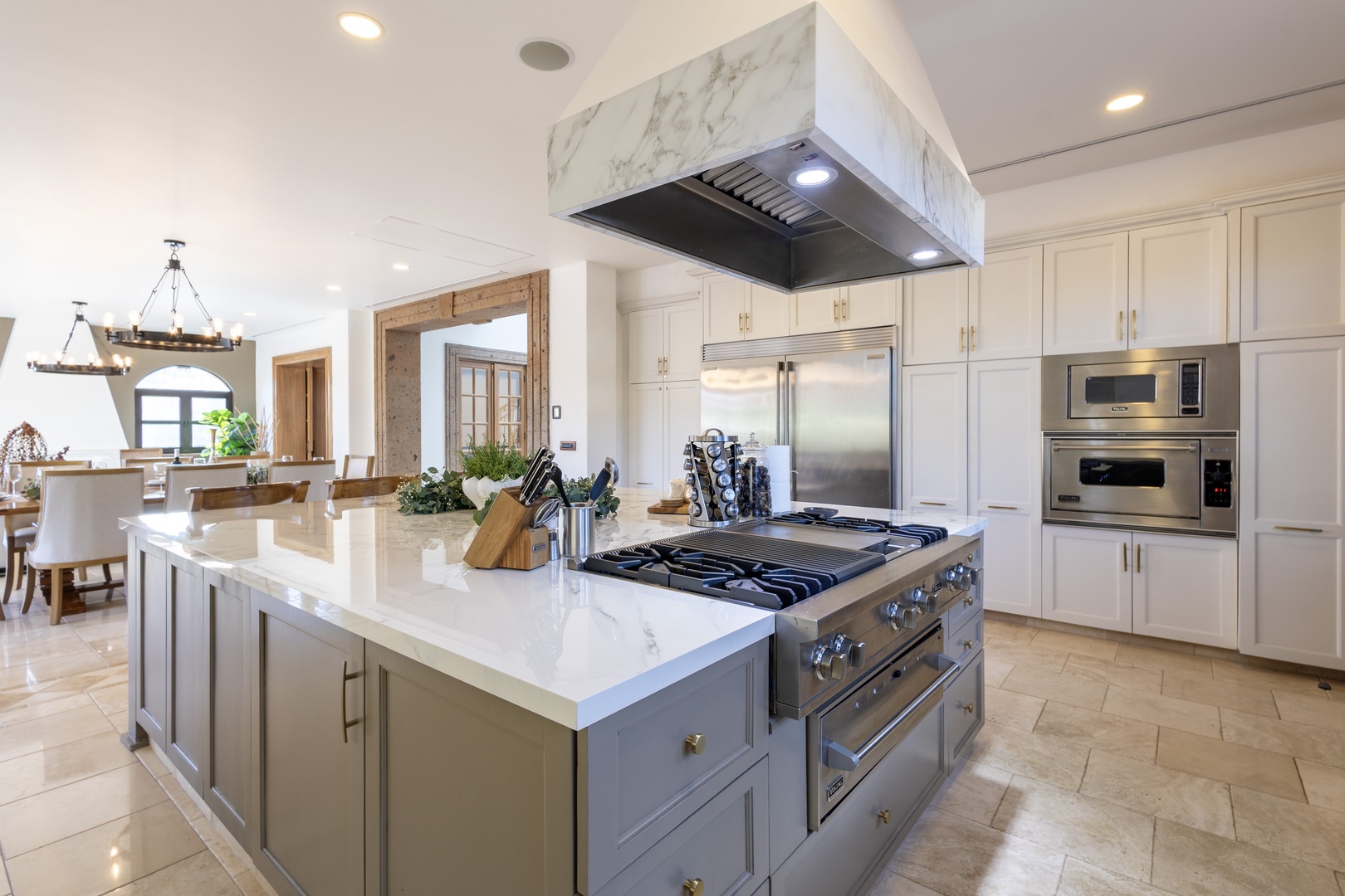 Step into this stunning gourmet kitchen where culinary dreams come alive. Gleaming marble, pro-grade appliances, and generous counter space invite you to whip up memorable meals during your stay.