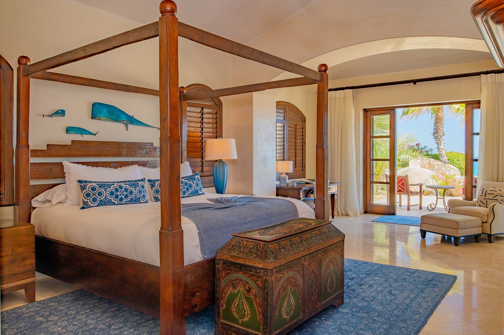 Drift off in your elegant four-poster bed with ocean breezes flowing through your private terrace doors and tropical views beyond.