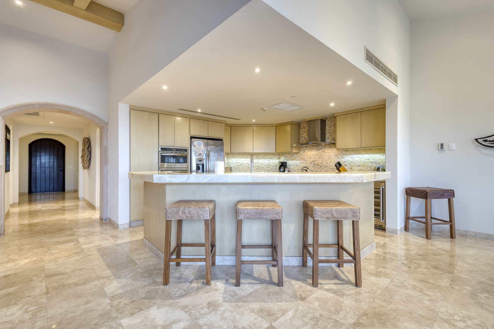 Your gourmet kitchen awaits with sleek countertops, modern appliances, and a spacious island where you can gather for meals or morning coffee in effortless style.