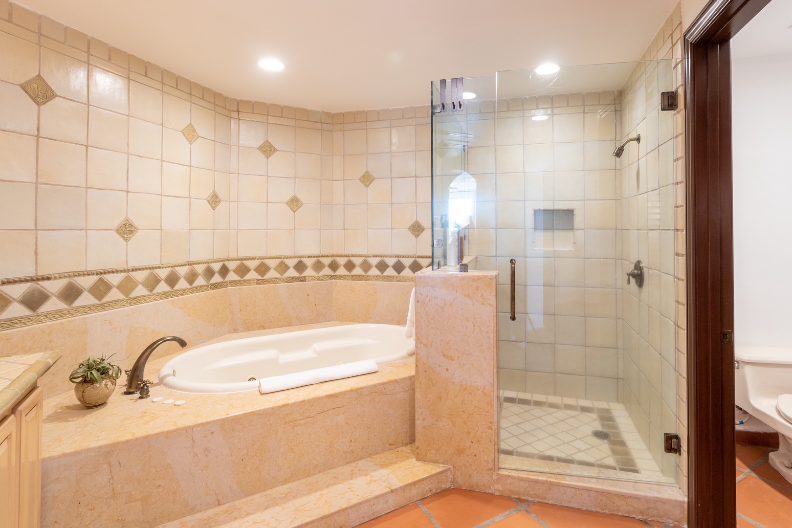 Unwind in your private spa-like bathroom with a soaking tub and spacious walk-in shower, designed for pure relaxation.